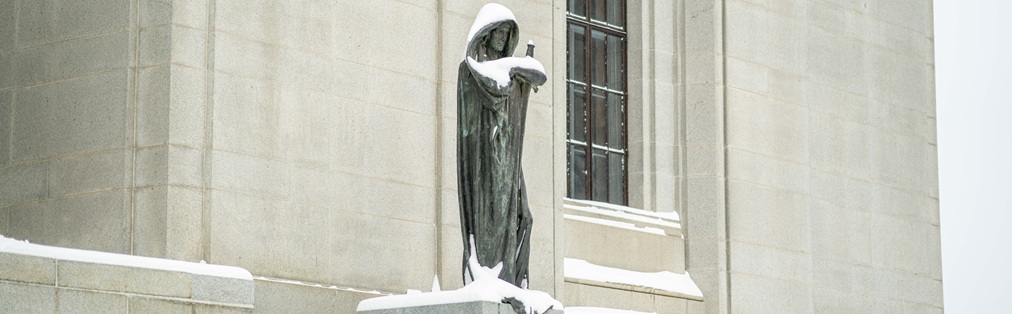 A statue in front of the Supreme Court of Canada building