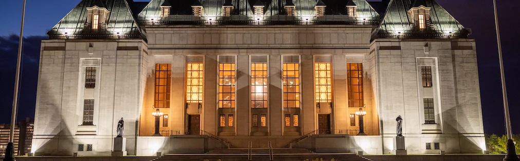 The Supreme Court of Canada building lit up at night