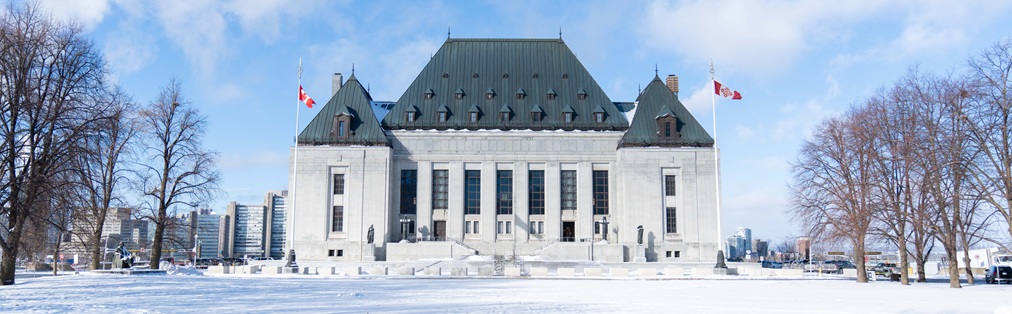 The exterior of the Supreme Court of Canada building in the winter