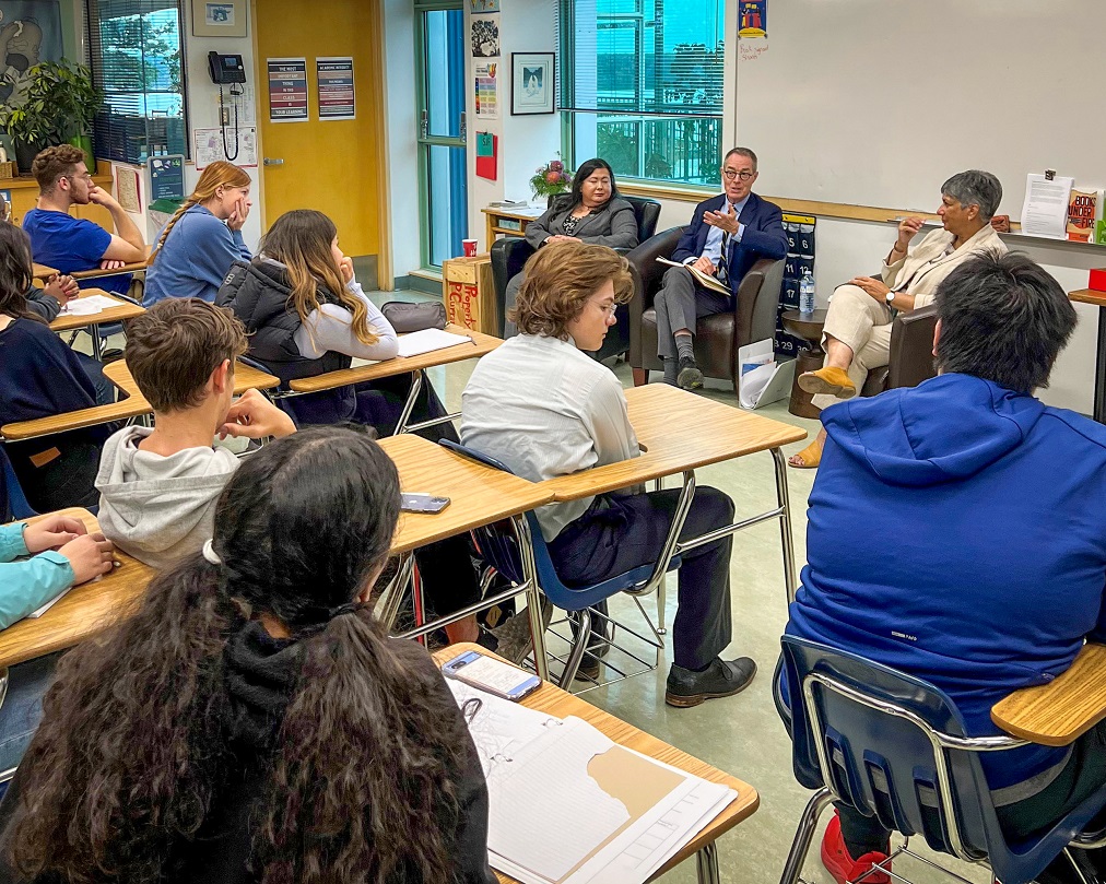 Justice Kasirer, Chief Justice of the Supreme Court of the Northwest Territories Shannon Smallwood and Chief Justice of the Court of Appeal for the Northwest Territories Ritu Khullar speaking to students in a classroom.