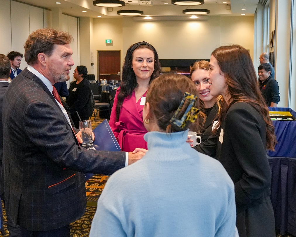 Chief Justice Wagner speaking to new lawyers at a reception.