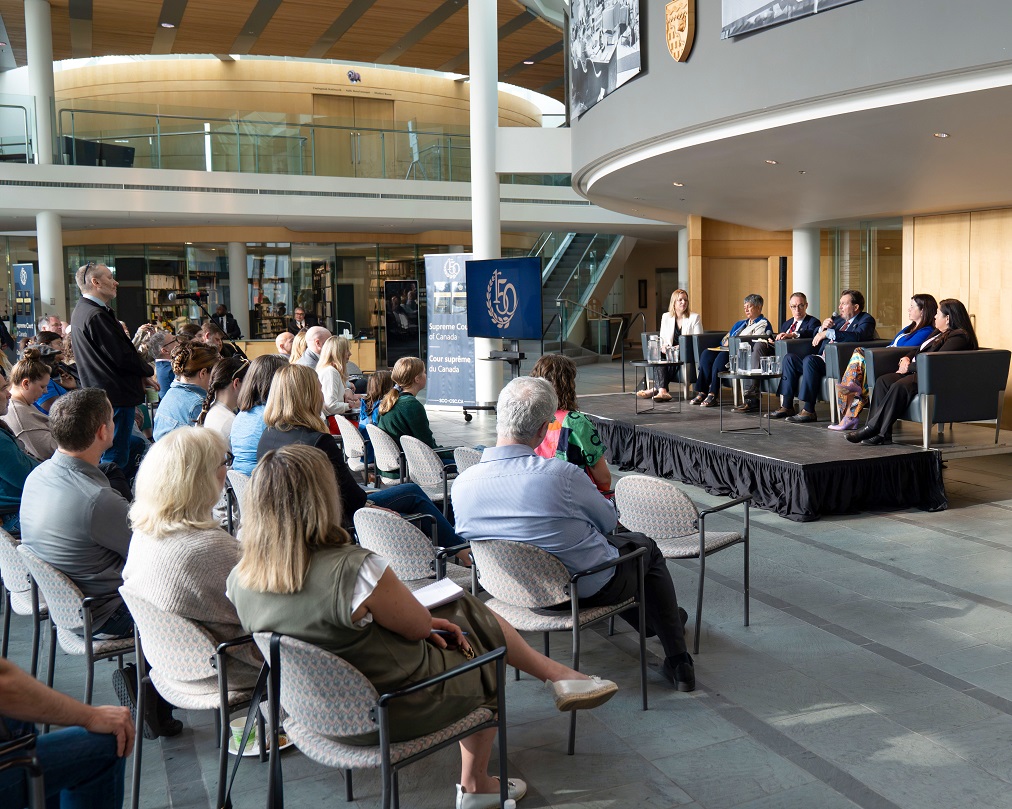 Chief Justice Wagner, Justice Kasirer, Justice O’Bonsawin, Chief Justice of the Supreme Court of the Northwest Territories Shannon Smallwood and Chief Justice of the Court of Appeal for the Northwest Territories Ritu Khullar speaking on stage during the public event.